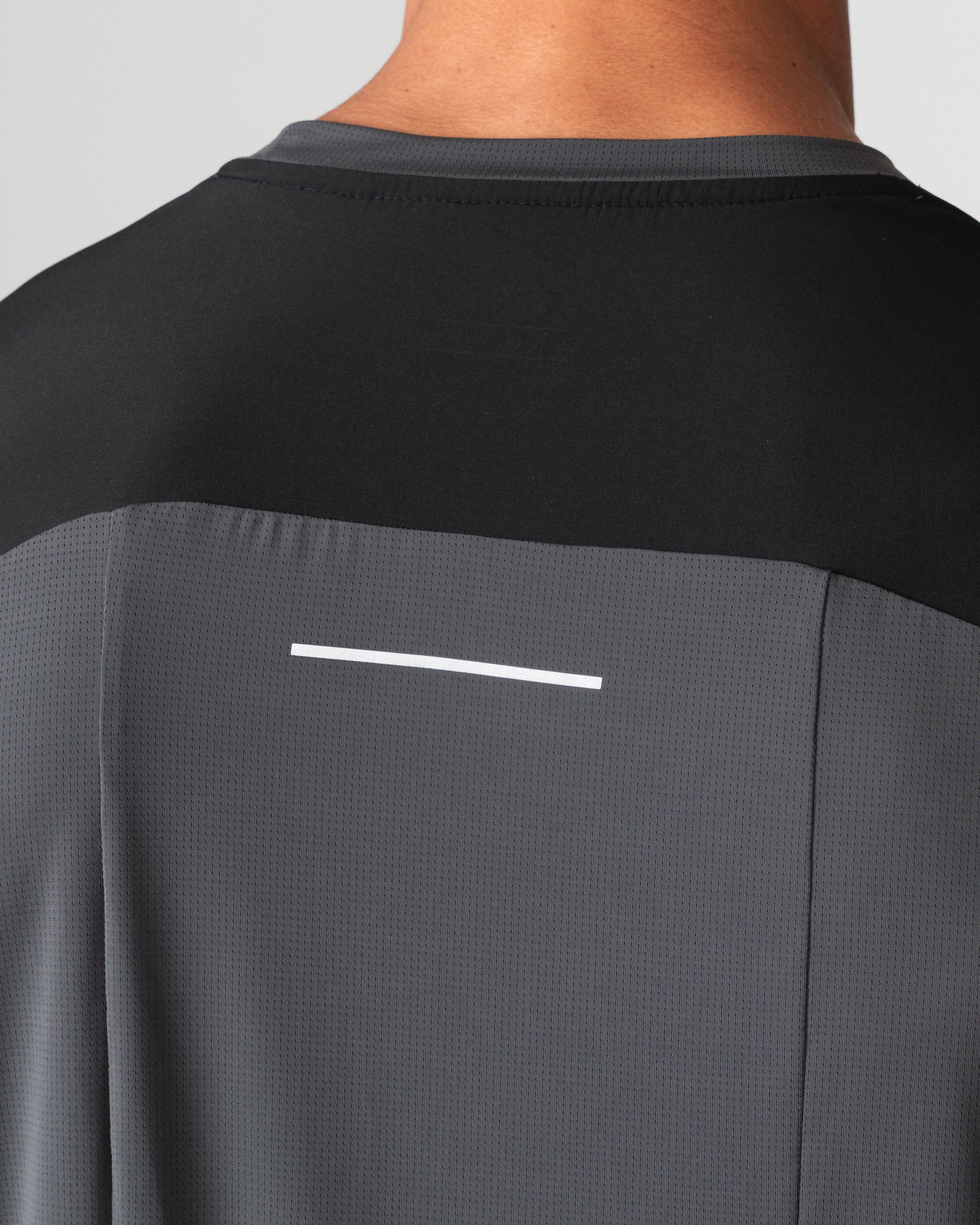SRG T-Shirt in black, close-up of back yoke and reflective detail
